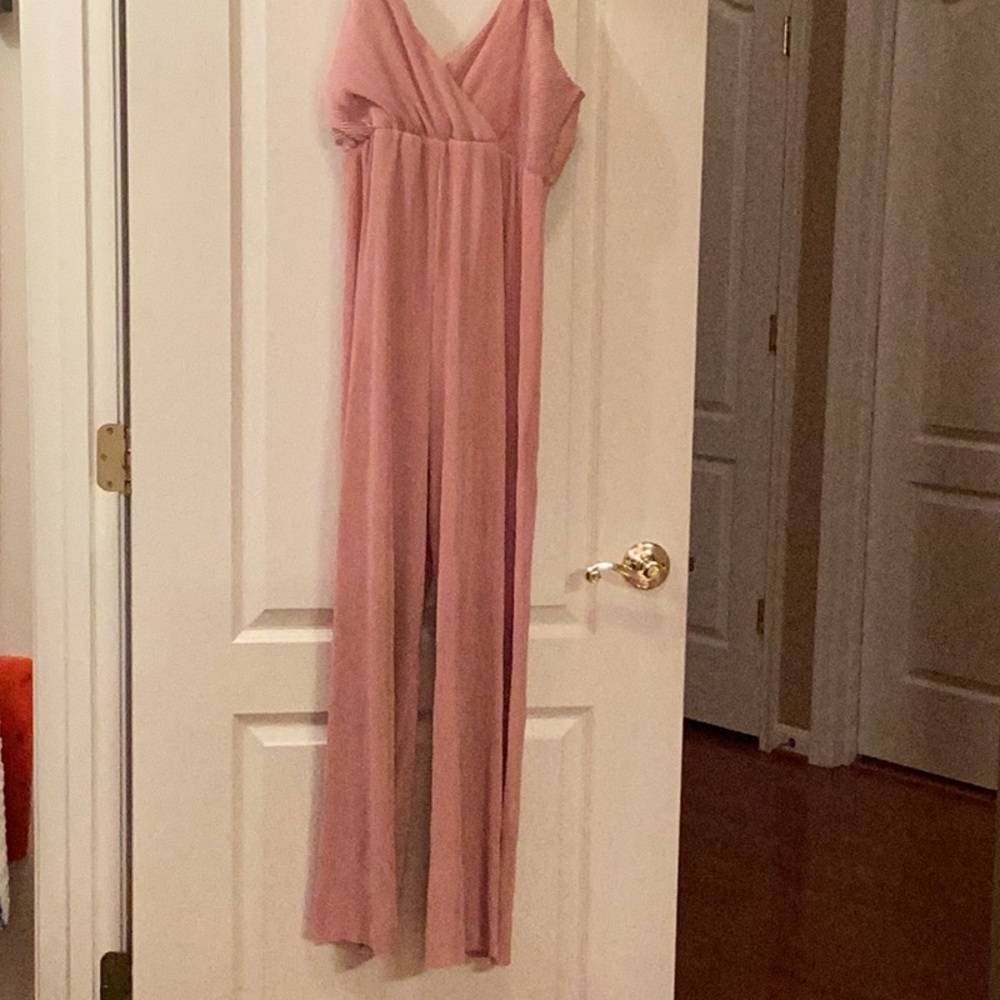 Dressy one piece pants jumper.   Never worn w/tag